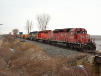 With a pleasing change from the usual GE power, CP 142 heads eastbound thru Jeannette mile led by St.L&H 5651, DME 6092 & ICE 6433 on a gloomy afternoon.