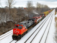 Same overpass and same leading engine... See the photo linked below to see a solo CN 2653 leading a short train underneath the Norman overpass in Lachine. This morning it was leading BCOL 4624 & CN 2153 and a long stack train. It would not enter Taschereau Yard but would continue west through Dorval and points west. http://www.railpictures.ca/?attachment_id=8935