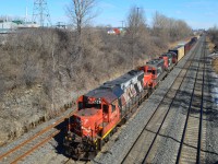 A westbound CN transfer passes through Lachine on its way to Taschereau Yard, led by a trio of Geeps: CN 4726, CN 7000 & CN 7228.