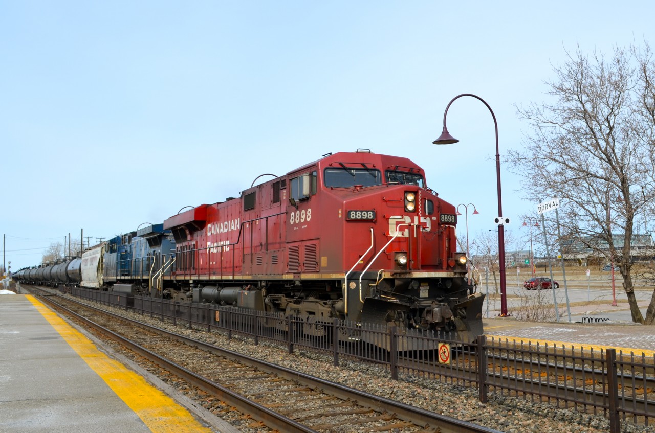 CP 8898 and CEFX 1028 are at the head end of an eastbound oil train at Dorval. On the rear is a second buffer car and a filthy, oil-covered AC4400CW (CP 9740).