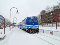 At the tail end of a large snowstorm, AMT 1354 deadheads east through Montreal West. On the other end of the train was another dual mode engine, AMT 1362. 