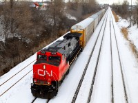 CN 2653 is in surprisingly good paint as it heads west through Lachine with a short train, on a gray afternoon. In a couple of minutes it will terminate at nearby Taschereau Yard.