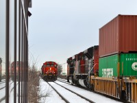 Reflected meet in Lachine - CN 4708, CN 4116 and CN 4785 are heading west, CN 2256 & CN 8915 are heading east with a stack train.