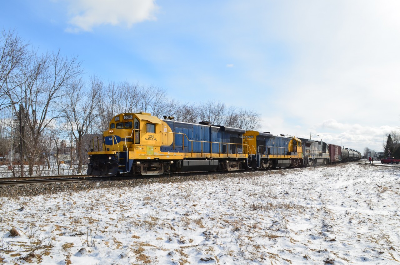 Two ex-Santa Fe B23-7's and a B39-8E head west through Farnham during a brief moment of sunshine on a chilly Sunday morning.