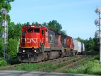 CN 370 is about to cross Hardy Road as it comes in to Brantford with CN C40-8 2130 leading. A nice way to start a work day.
