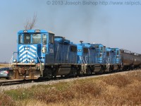 <b>Smoke a Little Smoke:</b> Three GP20D's smoke it up as they are notched out with a long cut of tank cars in the Garnet Yard.