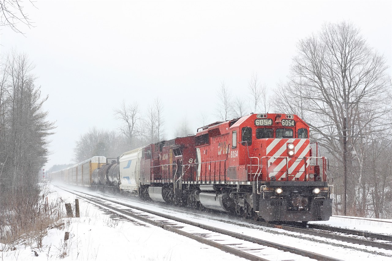 CP #240 kicks up fresh snow on the first day of spring. These days it getting rare catching SD40s in the lead.