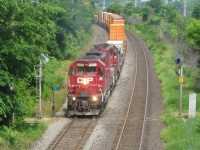 CP 5790 & CP 5746 (both SD40-2's) head west through Beaconsfield, Qc. Both must have been painted relatively recently, as they have CP's newest paint scheme and lack either beavers or multimarks.