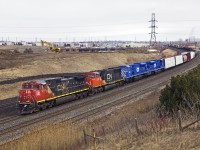 CN M373 came around the bend at Lovekin with a surprise, two bright blue CEFX SD90's, freshly outshopped from CADRail in Montréal. So naturally, a chase to the curve at Whitby was in order. CEFX 133, 118 are billed for Newton, IL and destined for the VTR in Vermont.