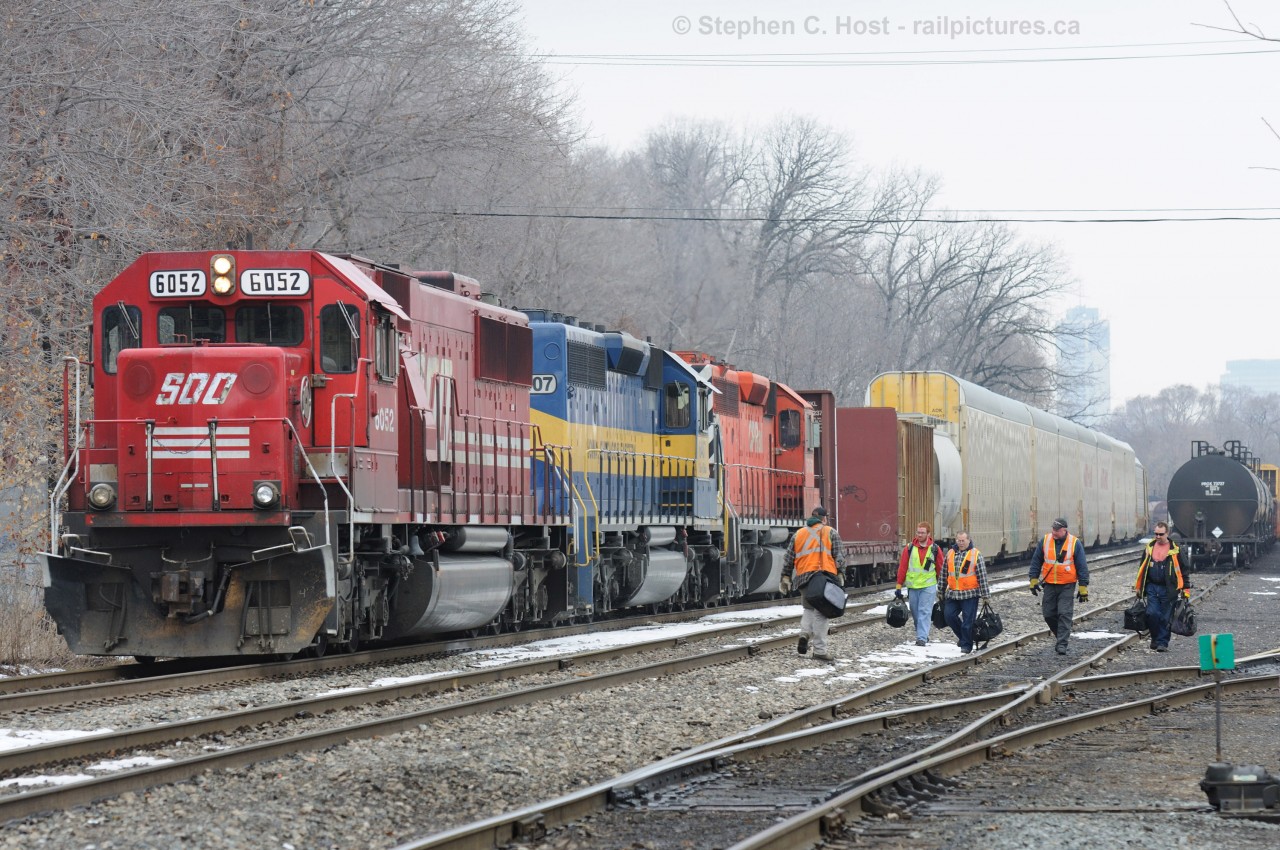 Crew Change:  Outbound and inbound crews share some brief words as they pass each other at the crew change point - also the London/Hamilton division yard office.