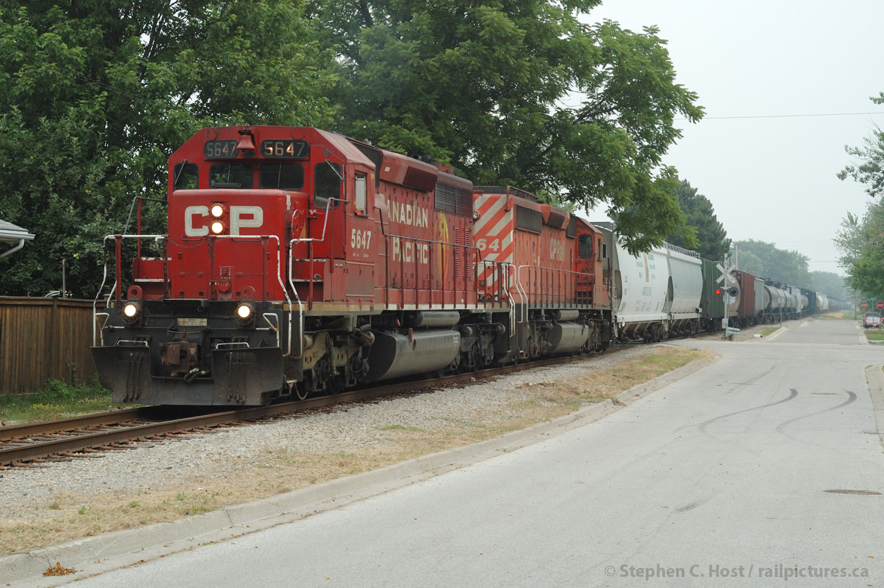 In response to Myles Roach's recent photos from Port Lambton - this is not a great shot - but you can't do this anymore. CSXT D725 with CP Run-through power and about 90 cars are southbound at Port Lambton, Ontario - all crossings in this little hamlet are blocked and will remain so for a while as the train trundles along at 15 MPH. Once all crossings are occupied the train will speed up to 25 MPH for the run to Wallaceburg and Chatham.