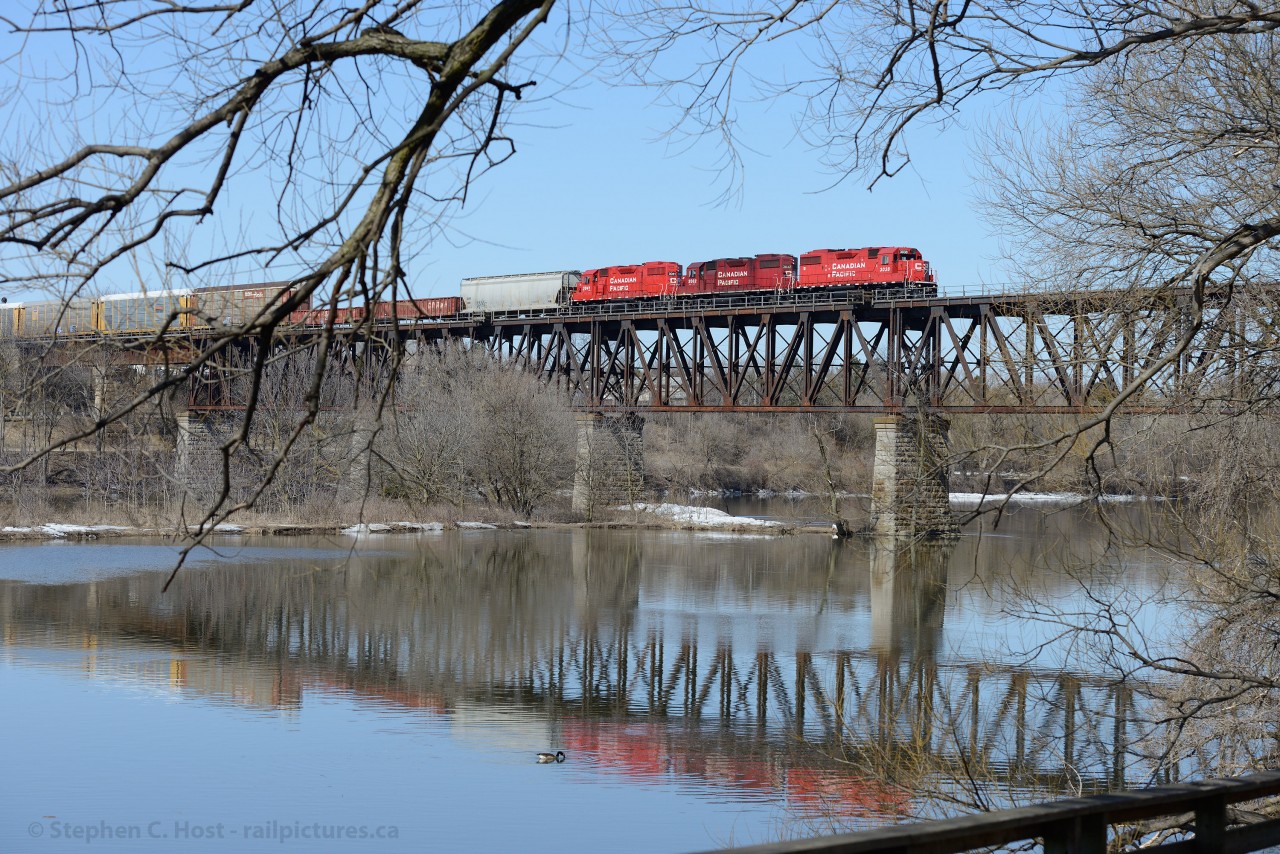 Spring is here - the last vestiges of Winter are rapidly melting away and foliage will soon appear. Pictured is CP Local job #TK22 - (Wolverton to Hagey and return) having just arrived at Galt - first few cars set off in the yard and the balance empty autoracks for Toyota up the Waterloo sub.