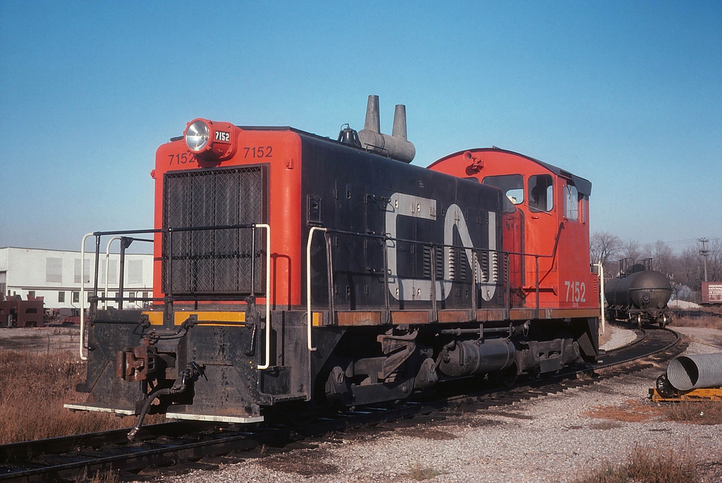 Back when Woodstock had a yard engine assigned to handle the local duties CN 7152, a GMD SW8 sits on the west leg of the wye. Both are now long gone as is the short segment of track that continued north of the wye part of the remains of the old Port Dover & Lake Huron Railway line.