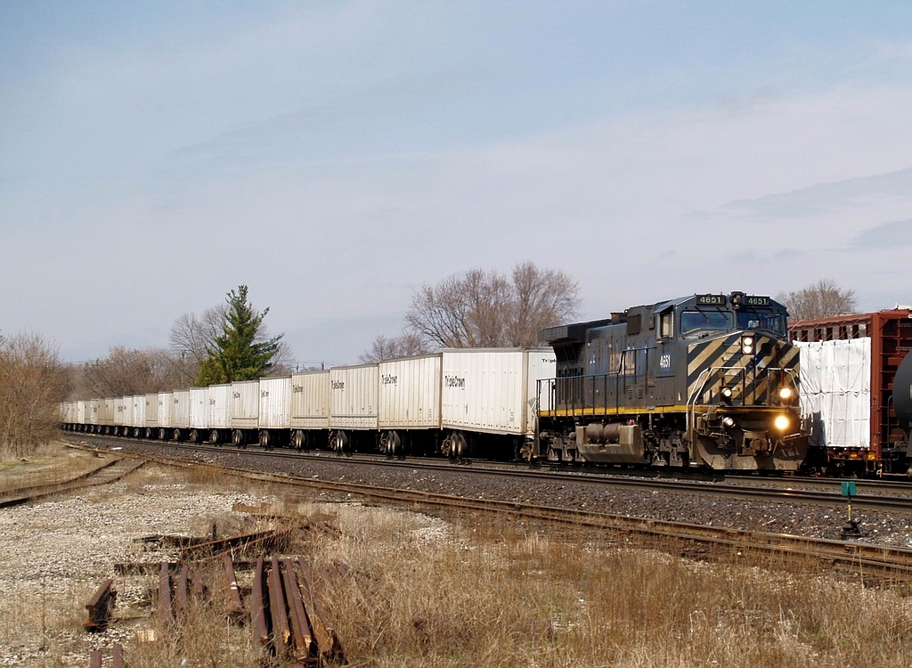 Due to delays over in Michigan this train was designated as an X144 due to it's late departure. Having a BC Rail unit leading is a rare treat on this train. BCOL 4651 has 66 Triple Crown trailers in check as they come down the grade into Brantford.