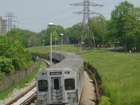<i><b>Over 7 decades ago...</b></i><br><br>
A warm spring day finds a 6-pack of TTC subway cars heading eastbound along the Bloor-Danforth line's eastern section open cut, between Victoria Park and Warden subway stations. 20 minutes later, the same train will be heading back west after turning at Kennedy Station. People enjoying a leisurely stroll at the nearby Prairie Drive Park pay no attention, likely used to the rumbling of the subway through Oakridge (Scarborough).
<br><br>
While a hydro corridor and subway line inhabit this open stretch in the photo, nearly 80 years before a railway line ran through here: the old Canadian Northern Railways (CNoR) Trenton Subdivision (later renamed the Orono Sub) from Todmorden (in the Don Valley) to Ottawa. Once Canadian National (CN) took over the Grand Trunk and CNoR in 1923, much of this line was eventually abandoned due to duplicate rail lines in the area (the current CNR Kingston Sub to the south being the main one). It would be another 40 years until construction of a subway line in the 1960's began and rail returned.