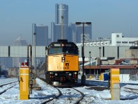 VIA 6439 readies for departure with Windsor (Walkerville) to Toronto train 72. Detroit's GM Renaissance Center looms in the background.