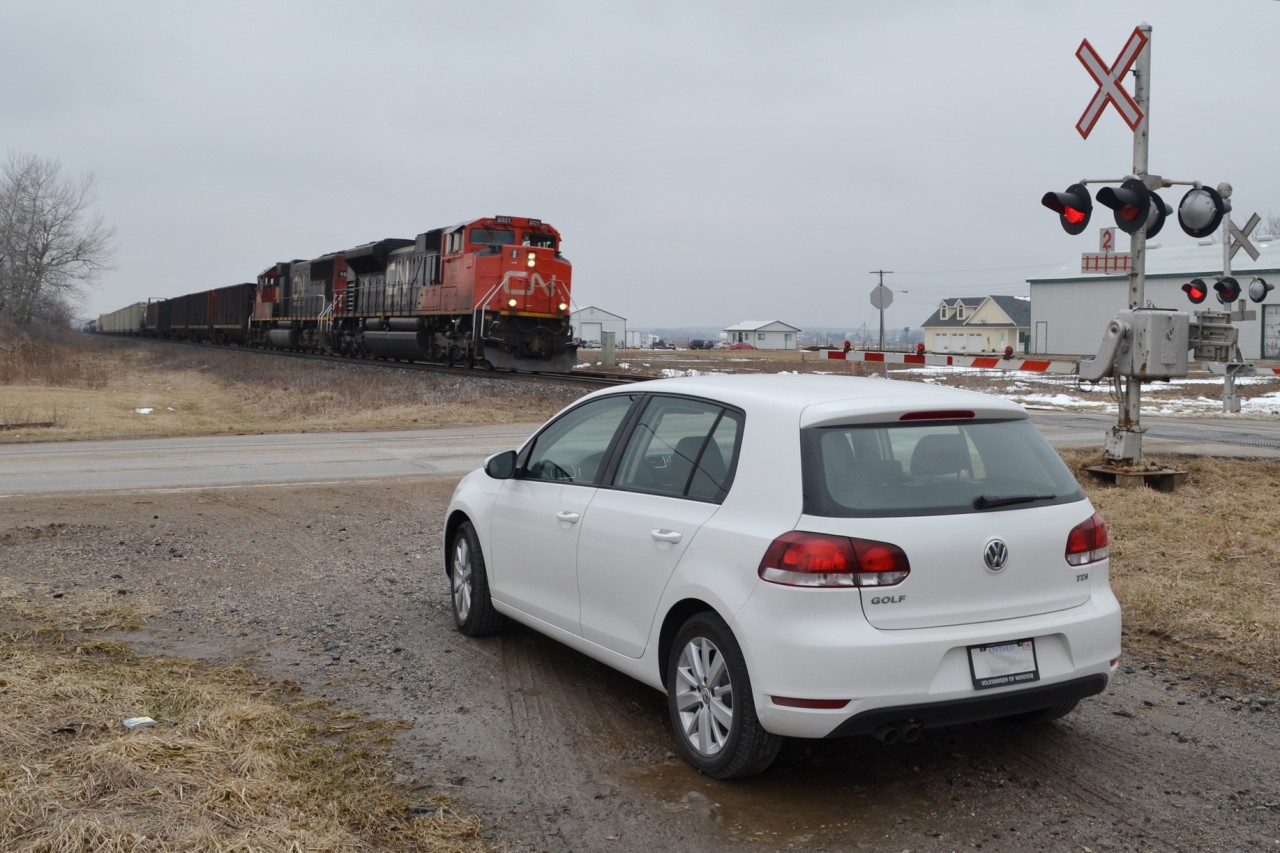 CN 8921 & IC 1008 fly pass the town of Kerwood, with my vehicle, a 2013 VW Golf TDI. It was great to have this Diesel driving around as I did over 550km of driving on just over 1/2 a tank of Diesel, and enjoying the smells of Diesel being pumped out of the Engines as they rolled pass.