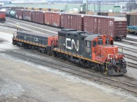 CN 7265 and CN 244, a set of Sarnia local Remote power, backs up into CN Sarnia Yard, after setting out cars on another track for CN 330 train.