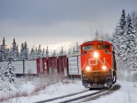 Prince George-Winnipeg train M304 gathers speed climbing towards the double track at Dalehurst. Yesterday, the entire 235.7 mile Edson Sub received between 10-20 inches of snow, making for some nice photos!