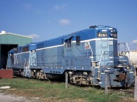 GEXR mother 66 and slug 4161 get some attention outside the shop in Goderich. GEXR 4161 was scrapped in 2008. GEXR 66, later renumbered 3834, was sold to a broker in 2011 and still resides in Goderich. 