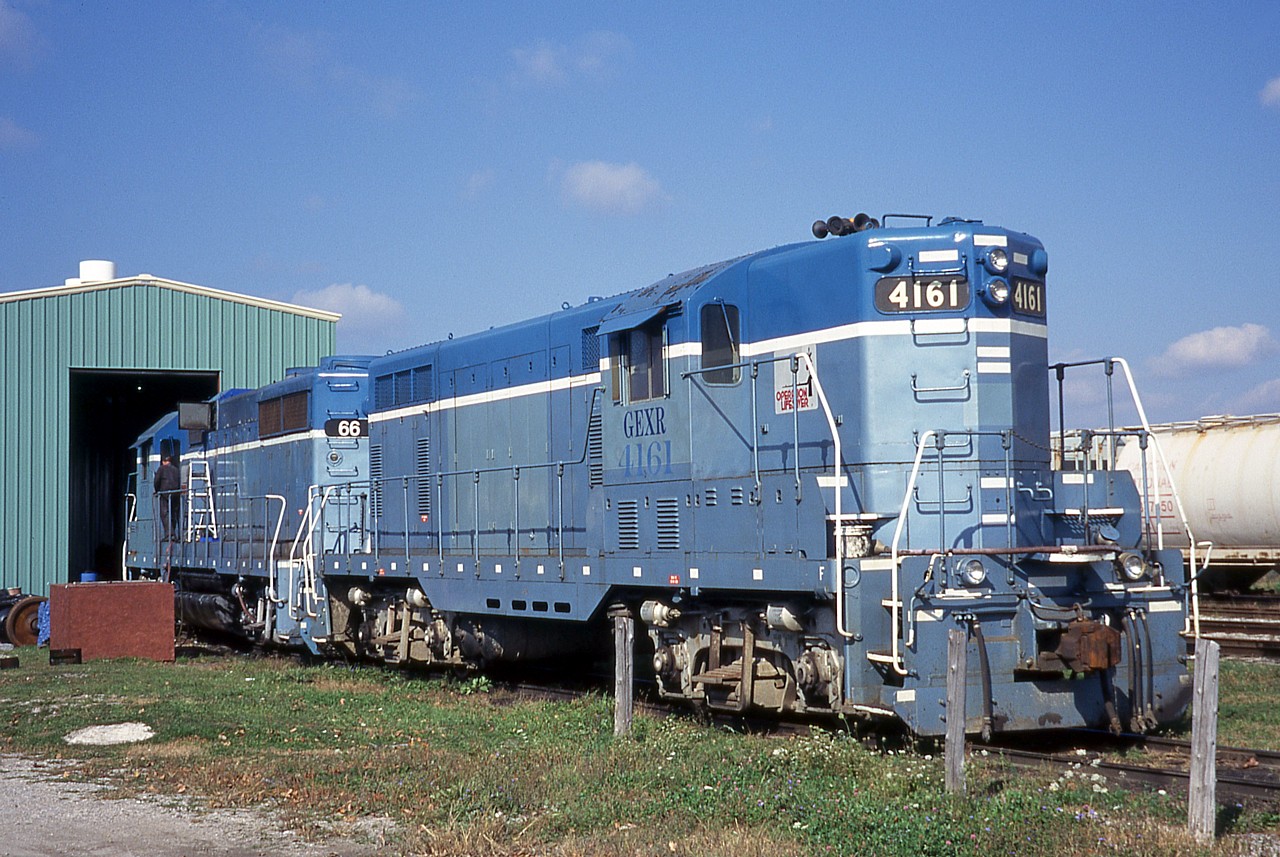 GEXR mother 66 and slug 4161 get some attention outside the shop in Goderich. GEXR 4161 was scrapped in 2008. GEXR 66, later renumbered 3834, was sold to a broker in 2011 and still resides in Goderich.