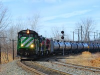 Bound for Farnham, a Montreal Maine & Atlantic crude oil train has just pounded the CP/CN diamond as it exercises trackage rights over Canadian Pacific.