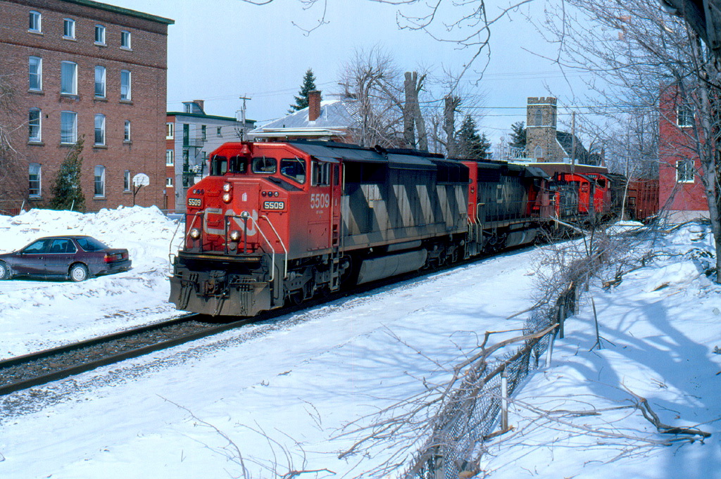CN 307 about to hit the 3rd crossing with a long train.