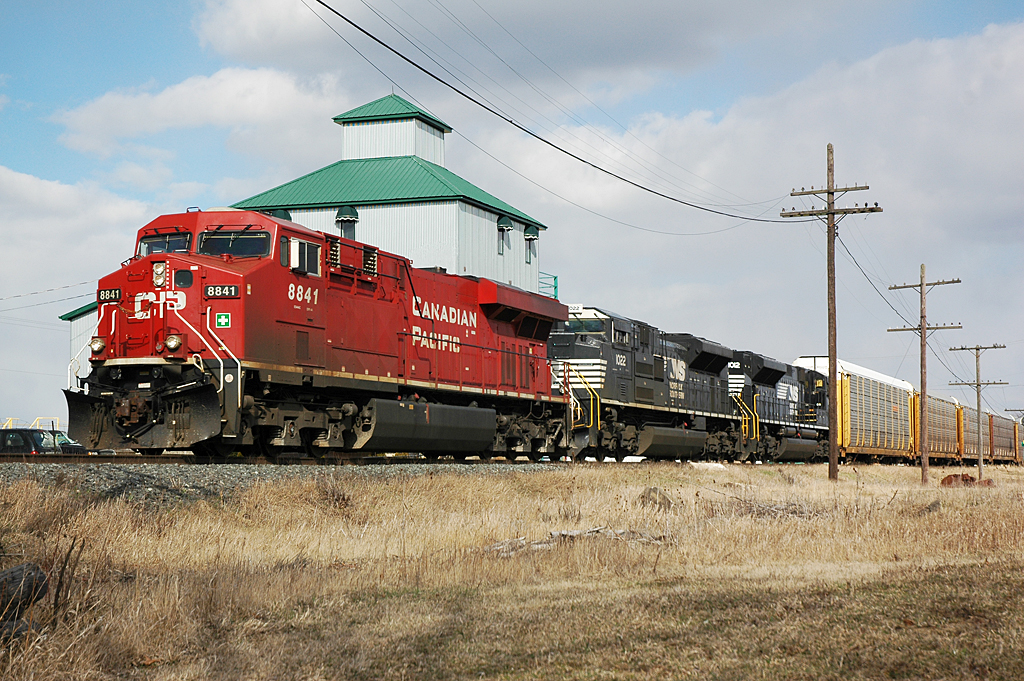 No foolin' around today.  CP train #147 with 8841 on point brings NS 1022 & 1012 back from their short trip into Canada.  #147 is passing the old Ruggaber Mill in Elmstead, Ontario and is wasting no time as they speed toward Windsor.