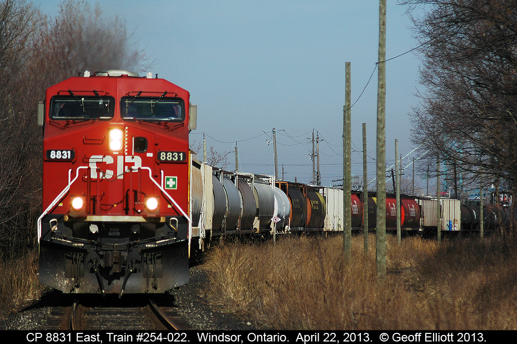 CP 8831 leads train 254-022 out of Windsor Yard and around the curve as it approaches Dougal Ave and 'Lakeshore' junction.