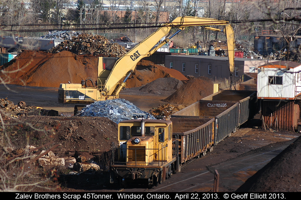 Zalev Brother's Scrap is in the middle of the city of Windsor, and here there 45 Tonner moves gons into place while a 'Cat' with a magnet drops metal into them.