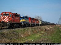 What you see is not always what you get.  In this case what looks like a CP leader is actually an ex-CP SD40, now DM&E 6086, leading westbound train #641 past MP 98 on the Windsor Subdivision with it's 80 empty ethanol tanks in tow.