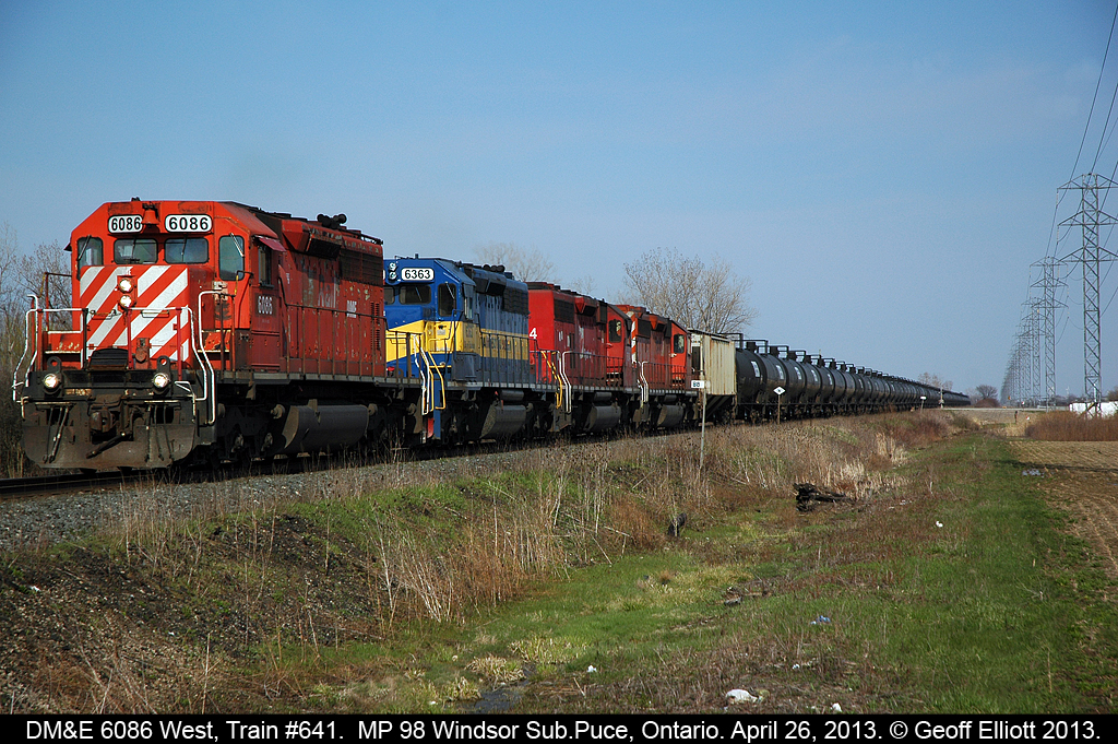What you see is not always what you get.  In this case what looks like a CP leader is actually an ex-CP SD40, now DM&E 6086, leading westbound train #641 past MP 98 on the Windsor Subdivision with it's 80 empty ethanol tanks in tow.