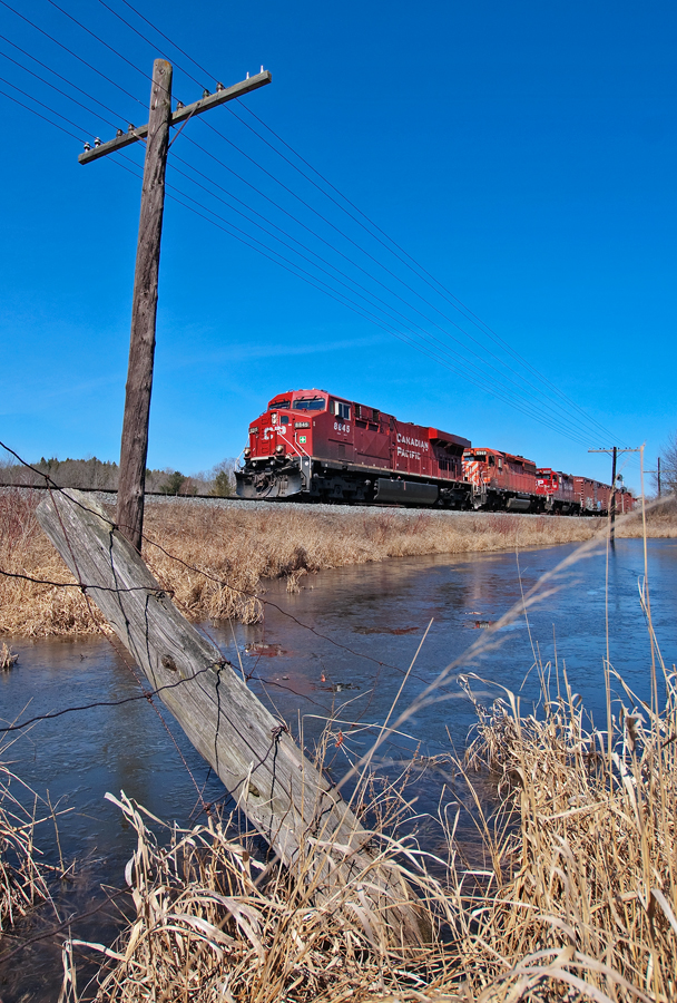 CP 2-420 flies past the South Siding Switch at Palgrave with a somewhat decent consist.