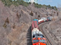 Moncton to Toronto daily manifest traffic, CN Train 305 is on it's final run to Mac Yard with 2337 leading and 8863 mid train and 11,000+ tons.