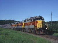 GP38-2 201 leads a GP7 and a second GP38-2 north with train #3 bound for Hearst. They have just crossed the highway at Heyden. 