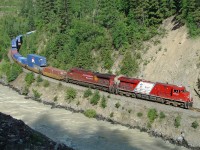 Another view of ES44AC CP 8876 in Vancouver Olympics livery, heading east just past Glenogle.