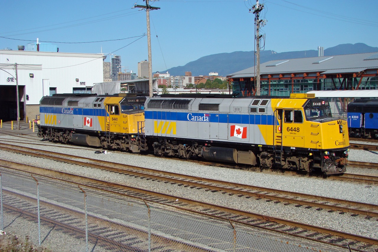 VIA F40PH-2's 6448 and 6441 sit in the VIA Pacific Station yard waiting their next assignment