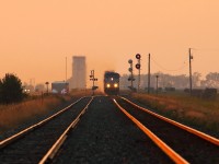 CP 118 approaches the west switch at Meadows on a very smoky evening.