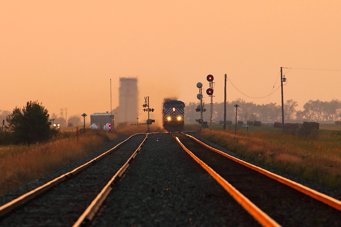 CP 118 approaches the west switch at Meadows on a very smoky evening.