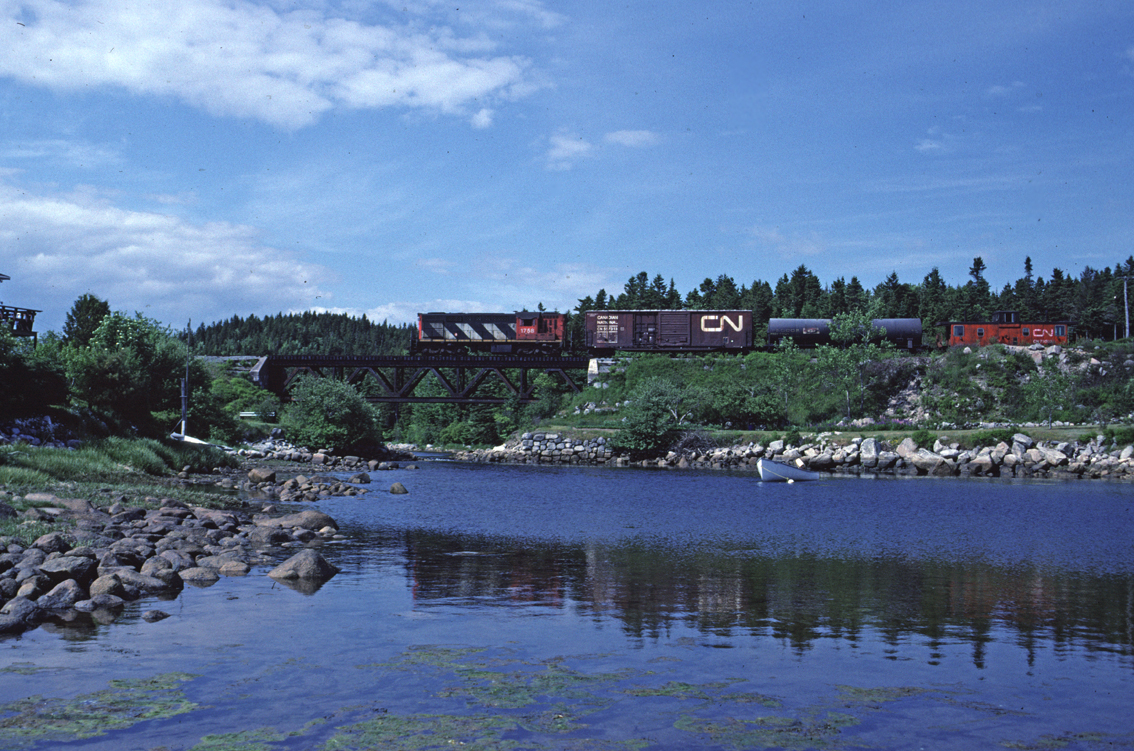 RSC-14 1758 leads a train that originated in Rockingham Yard in Halifax along the south shore of Nova Scotia. This line is now abandoned.