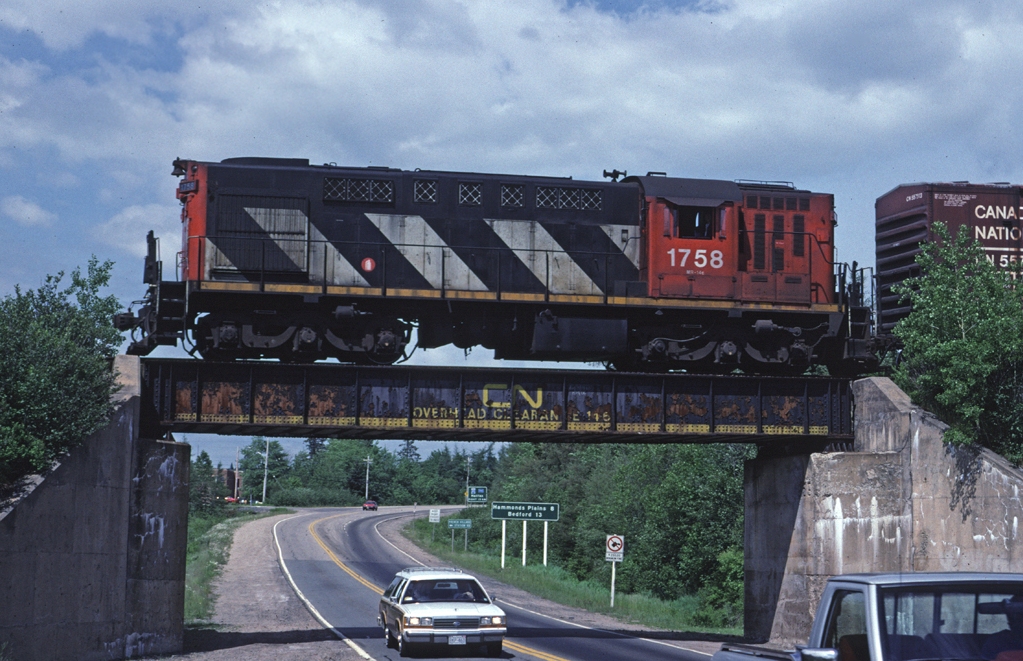 CN RSC-14 1758 leads a train that originated in Rockingham Yard in Halifax along the south shore of Nova Scotia. This line is now abandoned.