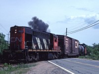 CN 1758 leads a train across St. Margarets Bay Road with a two car train along Nova Scotia's south shore. 