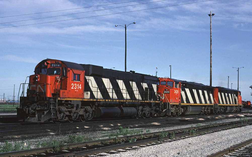 M-636 2314 sits with a pair of GEs at the north end of MacMillan Yard's diesel shop.