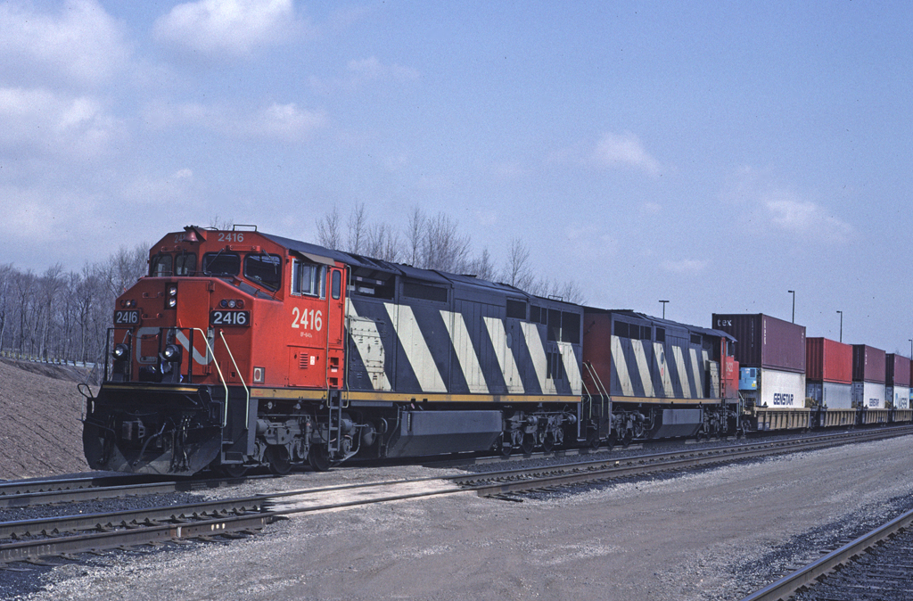 CN Dash8-40W 2416 leads Toronto - Buffalo doublestack train #255 as it pauses at Aldershot Yard.
