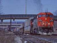 CN Dash8-40W 2428 leads Toronto - Buffalo doublestack  train #255 past Hamilton station.