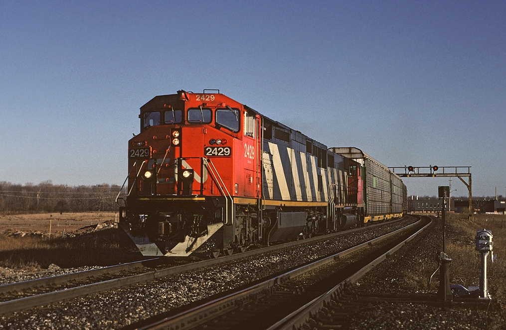CN Dash8-40W 2429 leads Toronto - Niagara Falls train #449 west on the Halton Sub, about to cross Mainway.