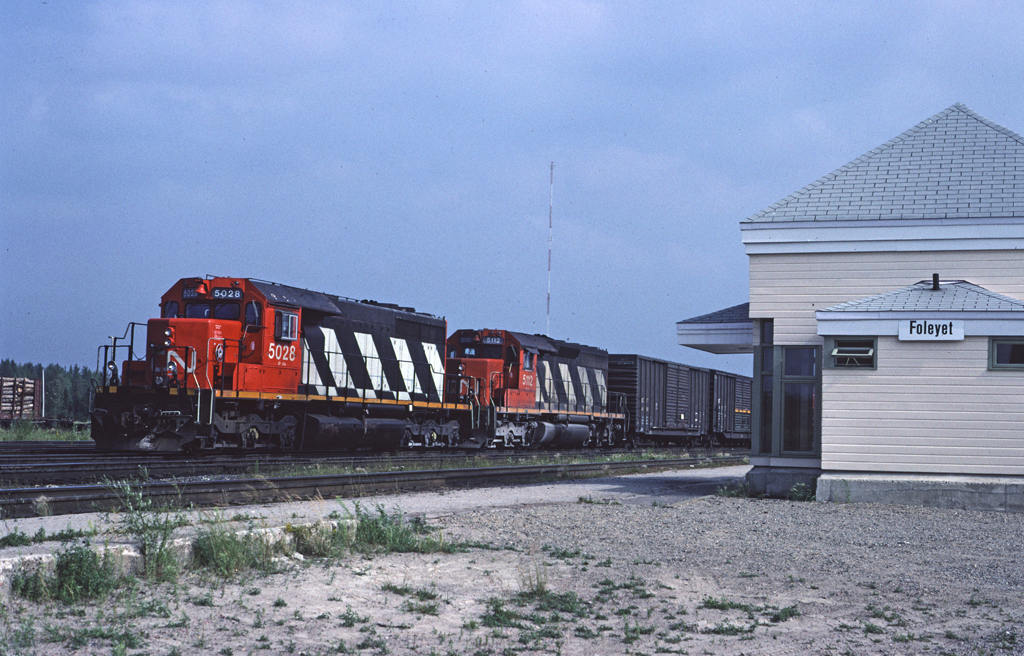 It's a very hot but quiet afternoon in Foleyet as CN 5028 with train #303 waits for a crew to take it west.