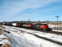 Annexed by the city of London in 1993, Hyde Park once featured a small station at this location, and a branch (Ilderton sub) that ran north from this location to Clinton Jct, on what is now the GEXR. Visible above the cab of CN 5320 is a bridge that allowed passage of trains northward under the CP Windsor Sub up until the early 1990's when the portion south of Exeter was abandoned and torn up. The crew of CN 330 probably doesn't notice the old right of way (now a hiking trail) as they coast downgrade towards London with a short train of mostly tank cars.
