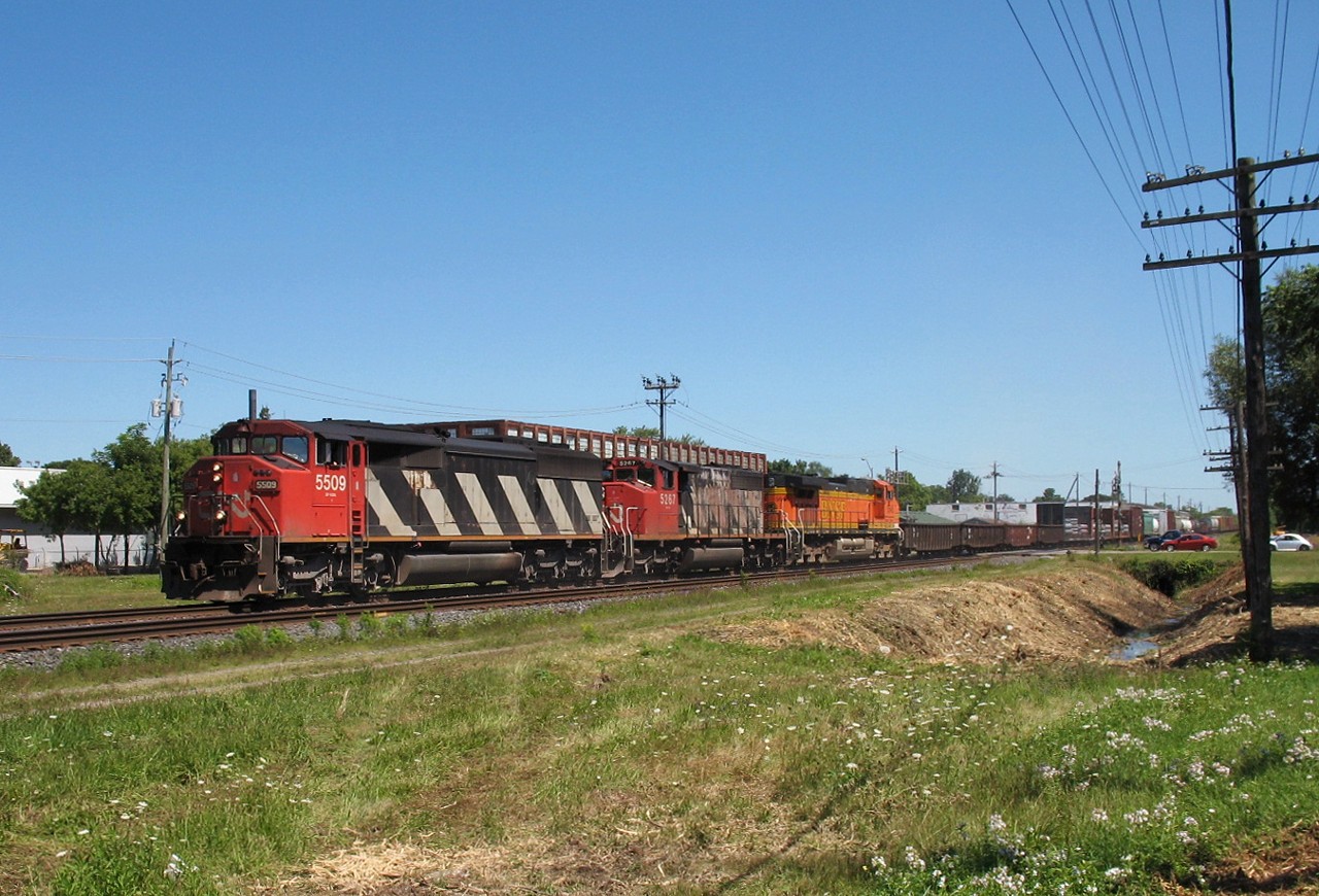 One of the first digital photos I took after retiring my trusty Minolta XGM was this westbound racing through Woodstock with a bit of FPON adding colour to the consist in the form of BNSF 5645.