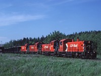 CP 1275 leads a train of loaded gypsum cars at the National Gypsum quarry at Mantua, Nova Scotia on the Dominion Atlantic. 